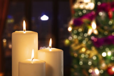 Close-up of burning candles during christmas