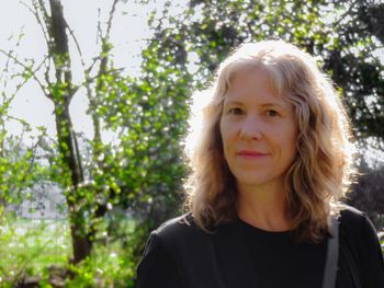 Portrait of mature woman against plants