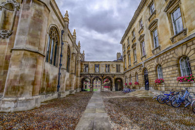 Footpath amidst buildings in city