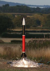 Model rocket launching on field