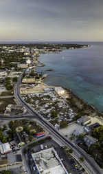 High angle view of city by road against sky