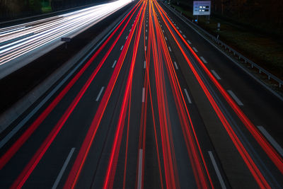 High angle view of light trails on road in city