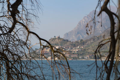 Scenic view of sea and buildings against sky