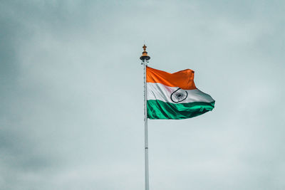 Low angle view of indian flag against sky