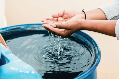 Close-up of hands in water