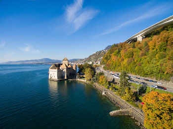 Panoramic view of buildings and mountains against sky