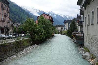 River amidst buildings in town