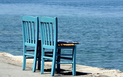 Chairs on terrace by sea