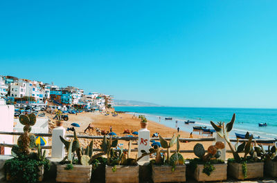 Scenic view of sea against clear blue sky