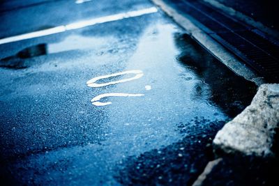 Close-up of road marking on street