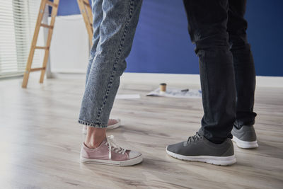 Low section of people standing on floor