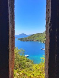 Scenic view of sea against clear blue sky