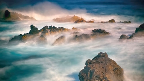 Panoramic view of rock formation against sky