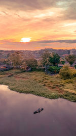 Scenic view of lake against sky during sunset