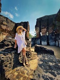 Full length of woman standing at historic place