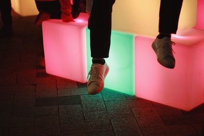 Low section of woman sitting on chair