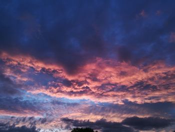 Low angle view of dramatic sky during sunset