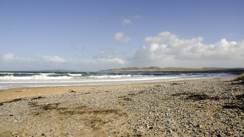 Scenic view of beach against sky