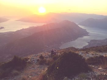 Scenic view of mountains against sky during sunset