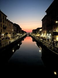Reflection of buildings in city at night