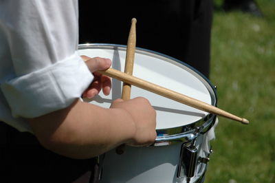 Close-up of hands playing guitar