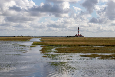 Tideway at the westerheversand lighthouse at high tide