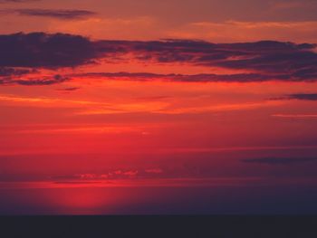 Scenic view of sea against romantic sky at sunset