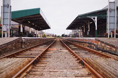 Railroad tracks at railroad station platform