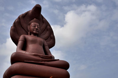 Low angle view of statue against sky