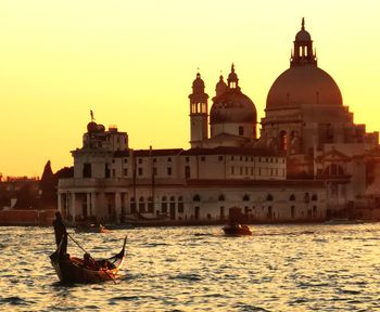 View of boats in canal against buildings