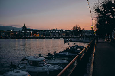 Scenic view of river by buildings against sky at sunset. genf, geneve, geneva, switzerland.