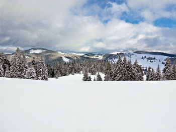 Scenic view of mountains against sky during winter