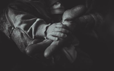 Close-up of person holding baby