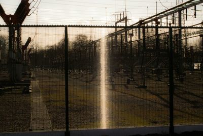 Chainlink fence at sunset