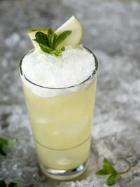 Close-up of juice with crushed ice in glass