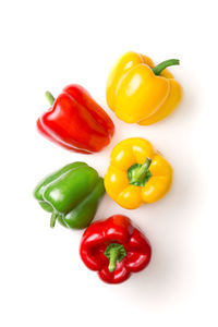 Close-up of bell peppers against white background