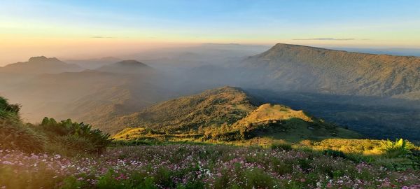 Scenic view of mountains against sky during sunset