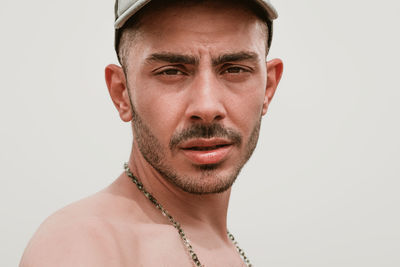 Portrait of mid adult man against white background