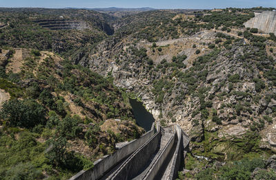 View across the valley from almendra dam, also known as villarino dam, in salamanca, spain