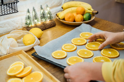 How to dry orange slices for eco friendly zero waste holiday decor. close up process of drying