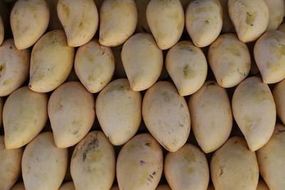 Full frame shot of mangoes arranged at market for sale