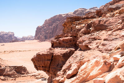 Rock formation on land against clear sky