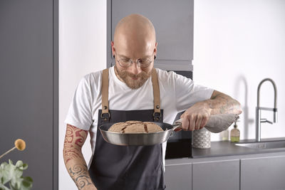 Man smelling on freshly baked sourdough bread 