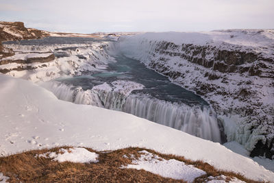 Scenic view of sea against sky during winter