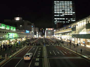 Crowd on illuminated city at night