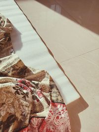 High angle view of woman relaxing on bed at home