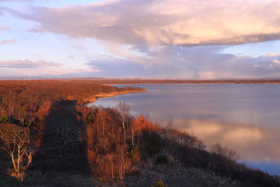 Scenic view of lake against sky during sunset