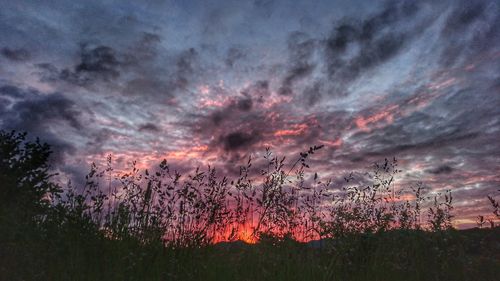 Scenic view of landscape against sky at sunset