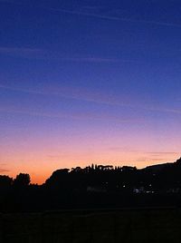 Silhouette of landscape against sky at sunset