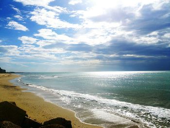 Scenic view of beach against sky